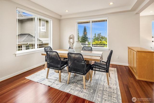 dining area featuring baseboards, recessed lighting, and wood finished floors
