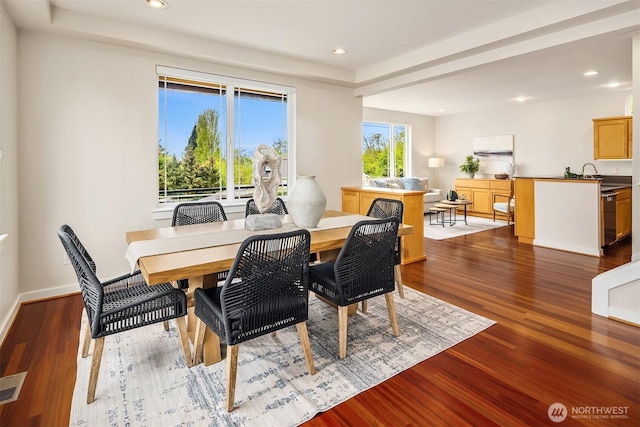 dining space with baseboards, recessed lighting, wood finished floors, and visible vents