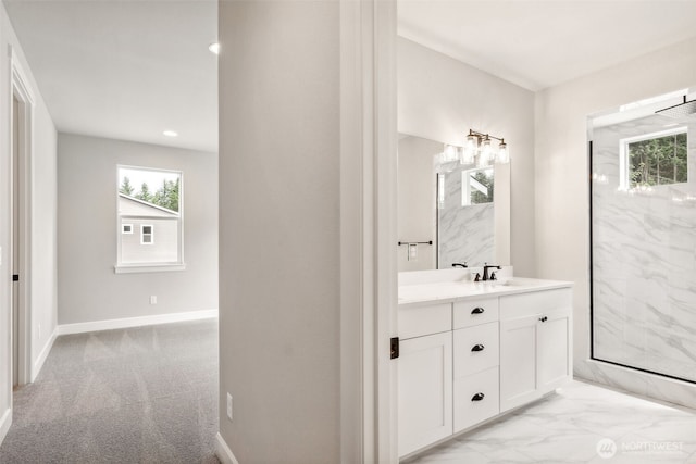 bathroom with recessed lighting, vanity, a marble finish shower, marble finish floor, and baseboards