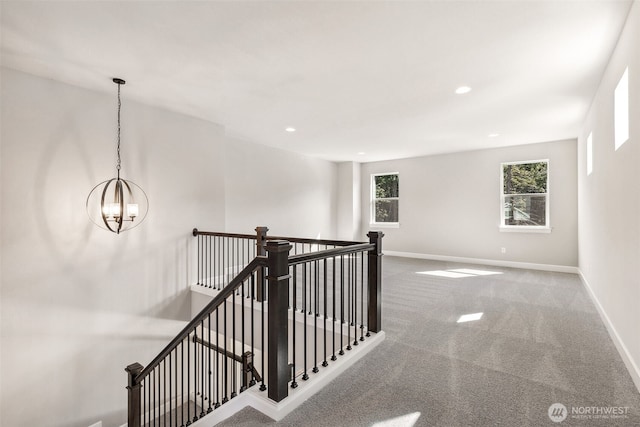 stairs featuring recessed lighting, baseboards, a chandelier, and carpet floors