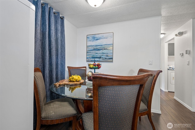 dining room with washer / dryer and wood finished floors