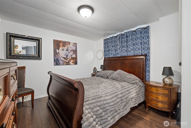 bedroom featuring dark wood-style flooring