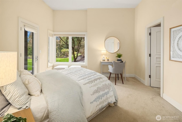 bedroom with access to exterior, carpet, and baseboards