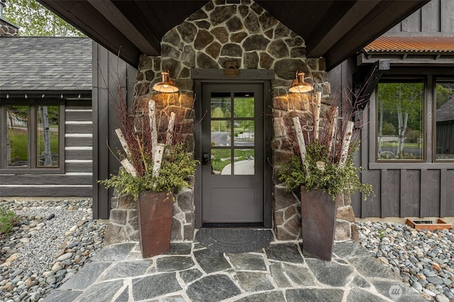 8105 Icicle Rd, Leavenworth, WA 98826 - view of exterior entry with french doors, stone siding, and board and batten siding