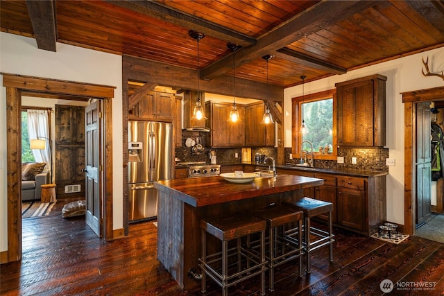 8105 Icicle Rd, Leavenworth, WA 98826 - kitchen featuring wooden ceiling, wood counters, stainless steel fridge, dark wood-type flooring, and wall chimney range hood
