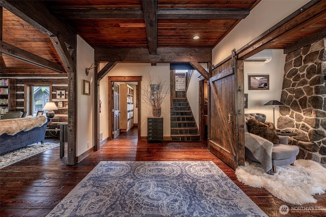 8105 Icicle Rd, Leavenworth, WA 98826 - entrance foyer featuring a barn door, hardwood / wood-style floors, beam ceiling, and wooden ceiling