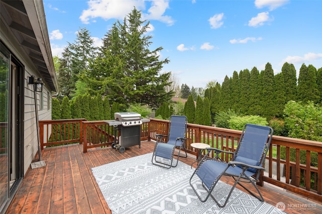 wooden deck with grilling area