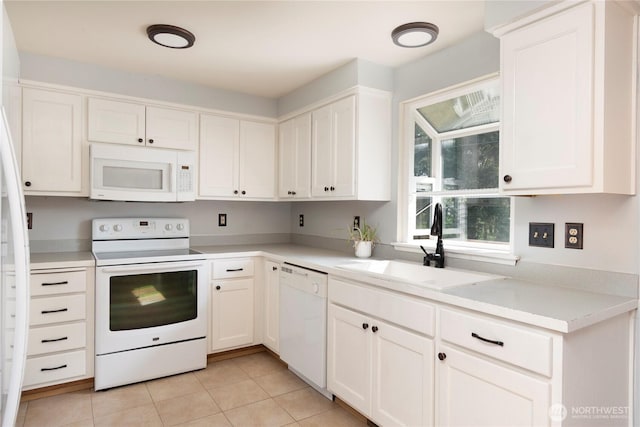 kitchen with a sink, light tile patterned flooring, white appliances, light countertops, and white cabinets