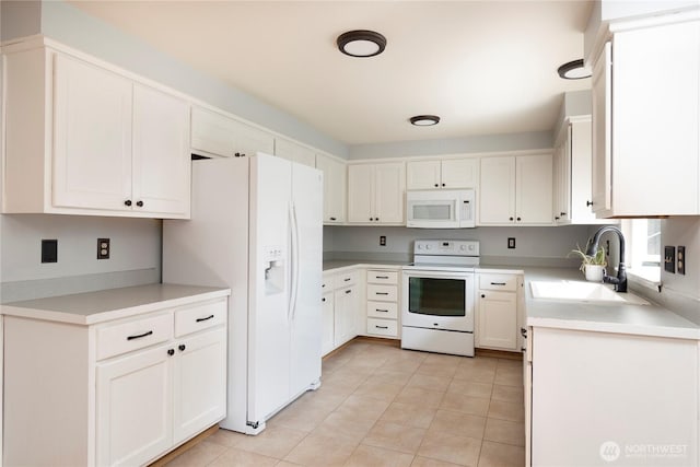 kitchen with a sink, light tile patterned flooring, white appliances, white cabinetry, and light countertops