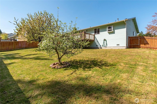 exterior space with a wooden deck and fence