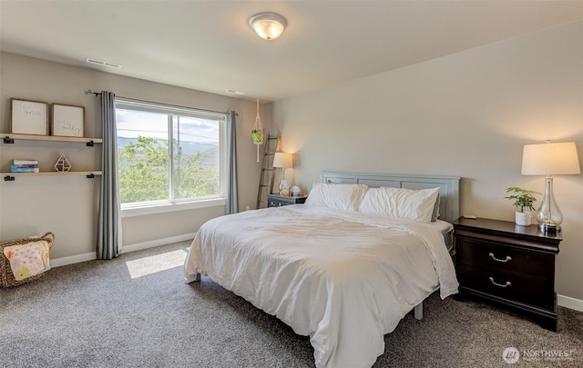 bedroom with visible vents, carpet flooring, and baseboards