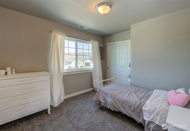 carpeted bedroom with visible vents and baseboards