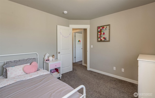 bedroom featuring baseboards and carpet flooring