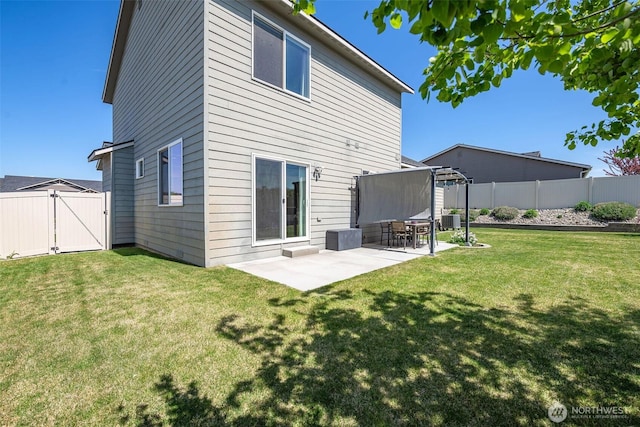 rear view of house featuring cooling unit, a fenced backyard, a gate, a patio area, and a lawn