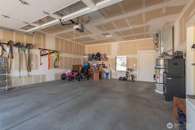 garage featuring gas water heater and a garage door opener