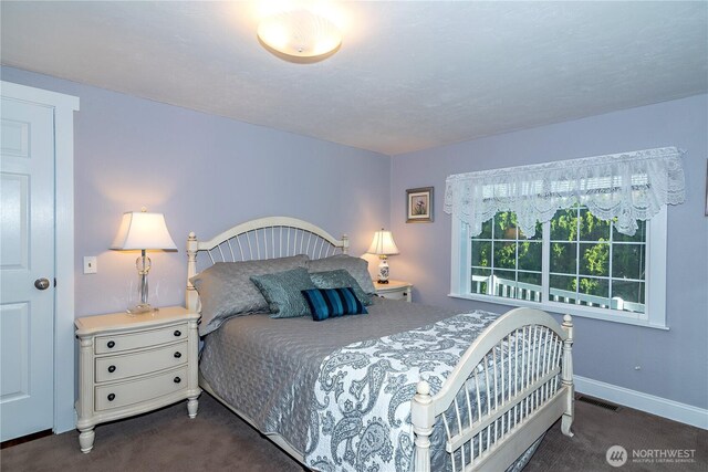 bedroom featuring carpet flooring, baseboards, and visible vents
