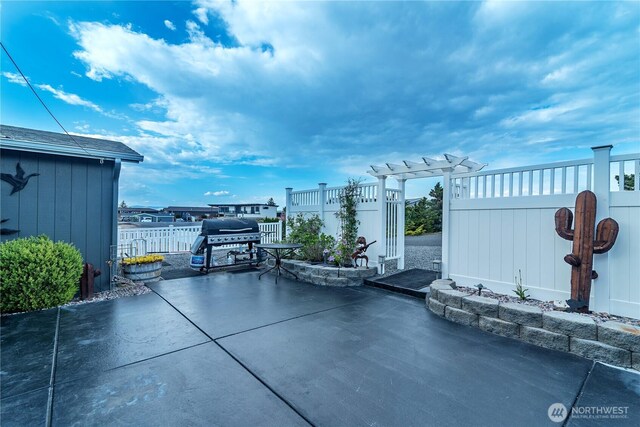 view of patio / terrace featuring fence and grilling area