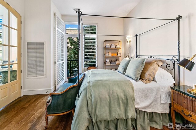 2801 1st Ave Unit 113, Seattle, WA 98121 - bedroom featuring wood finished floors, baseboards, and access to outside