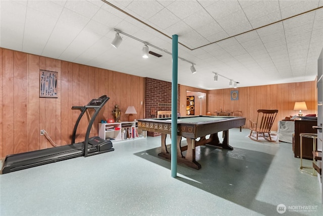 game room with track lighting, pool table, and wooden walls