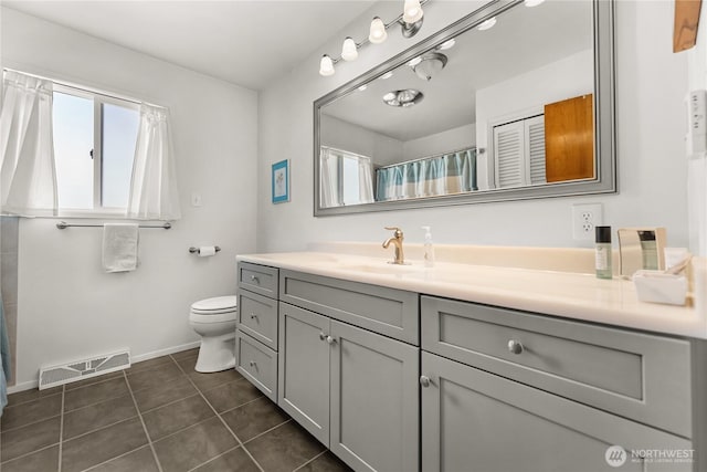 bathroom featuring visible vents, tile patterned flooring, baseboards, vanity, and toilet