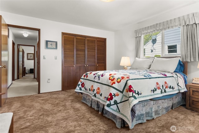 carpeted bedroom featuring a closet
