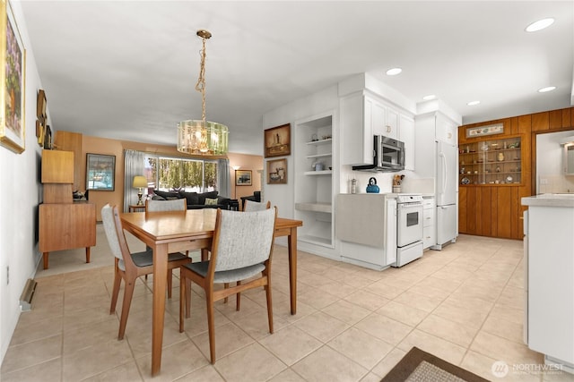 dining area featuring recessed lighting, light tile patterned floors, a chandelier, and built in shelves