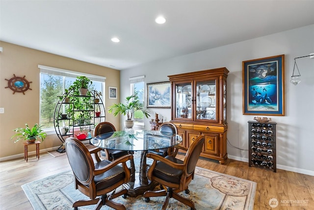 dining space with light wood finished floors, recessed lighting, and baseboards
