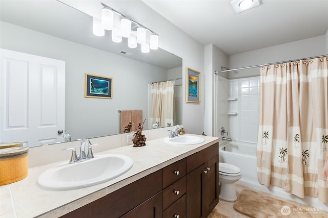 bathroom with double vanity, a sink, shower / bath combo, and visible vents