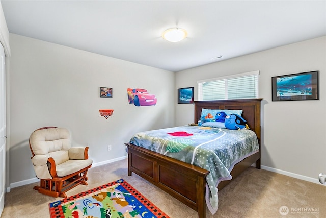 carpeted bedroom featuring visible vents and baseboards