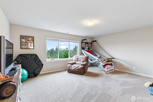 rec room with carpet and baseboards