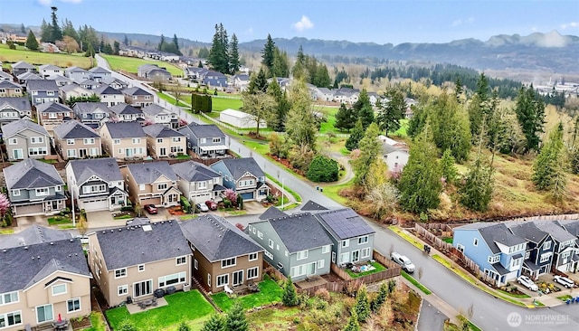 drone / aerial view featuring a mountain view and a residential view