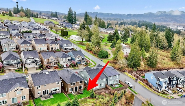 drone / aerial view with a residential view and a mountain view