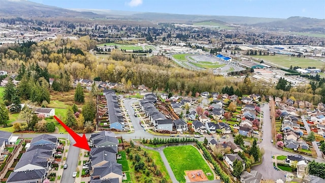 birds eye view of property with a residential view and a mountain view