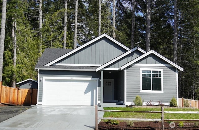single story home with board and batten siding, driveway, roof with shingles, fence private yard, and an attached garage
