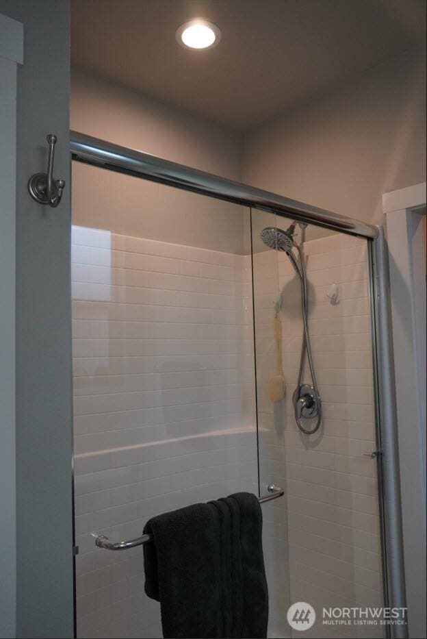 full bathroom featuring a stall shower