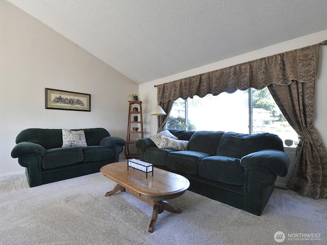 carpeted living room with a textured ceiling and lofted ceiling