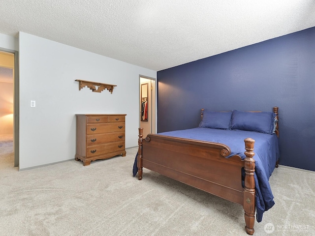 carpeted bedroom with a textured ceiling