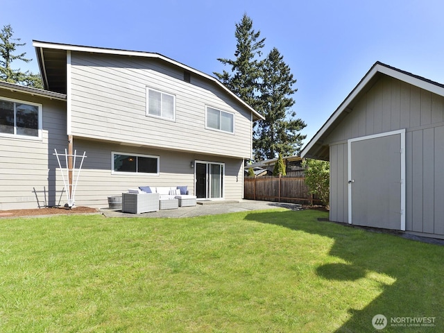 back of house featuring an outdoor hangout area, fence, a patio, and a yard