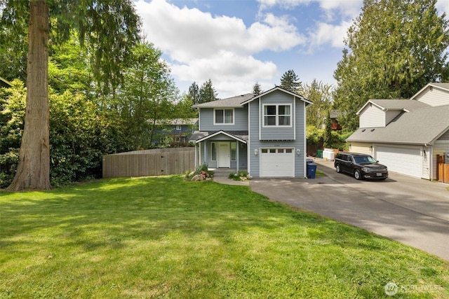view of front of property with an attached garage, a front lawn, aphalt driveway, and fence