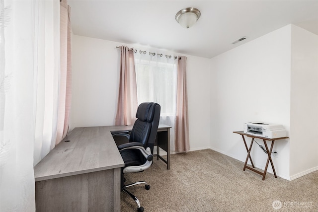 carpeted office featuring baseboards and visible vents