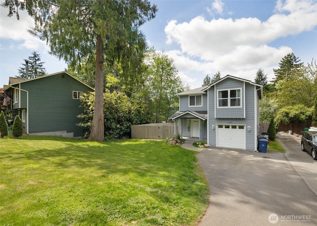 view of front of property featuring fence, an attached garage, a front lawn, and aphalt driveway