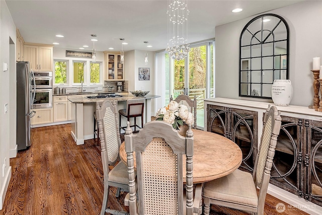 dining area with recessed lighting, a wealth of natural light, and dark wood-style floors