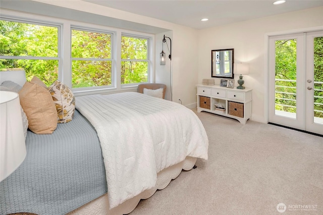 bedroom featuring multiple windows, carpet flooring, recessed lighting, and access to exterior