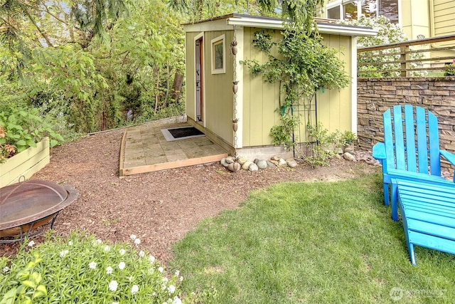 exterior space featuring an outdoor fire pit