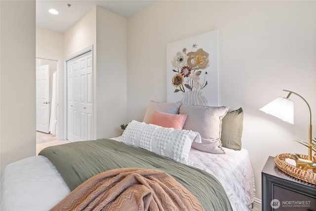 9229 122nd Ct NE Unit 13, Kirkland, WA 98033 - bedroom with recessed lighting, baseboards, and a closet