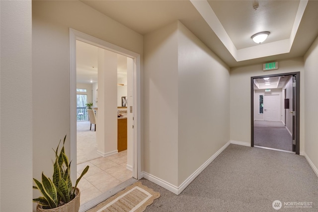 9229 122nd Ct NE Unit 13, Kirkland, WA 98033 - corridor featuring baseboards and light colored carpet