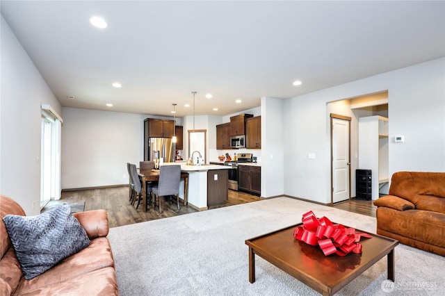 5198 Sophie St, Bremerton, WA 98312 - living area featuring baseboards, recessed lighting, and wood finished floors