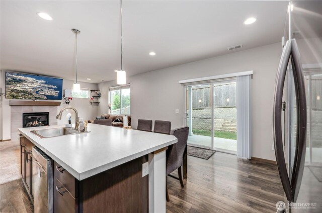 5198 Sophie St, Bremerton, WA 98312 - kitchen featuring dark wood-style flooring, a sink, stainless steel appliances, open floor plan, and visible vents