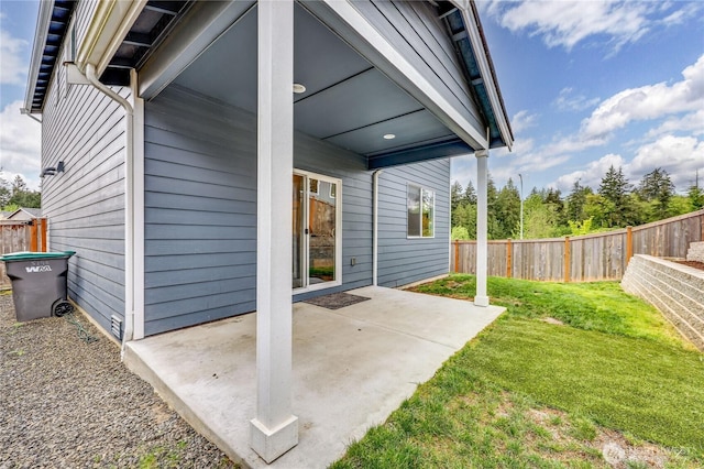 5198 Sophie St, Bremerton, WA 98312 - back of property with a lawn, a fenced backyard, and a patio area