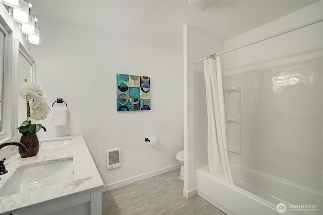 12120 218th Avenue Ct E, Bonney Lake, WA 98391 - bathroom featuring double vanity, toilet, baseboards, shower / bathtub combination with curtain, and a sink